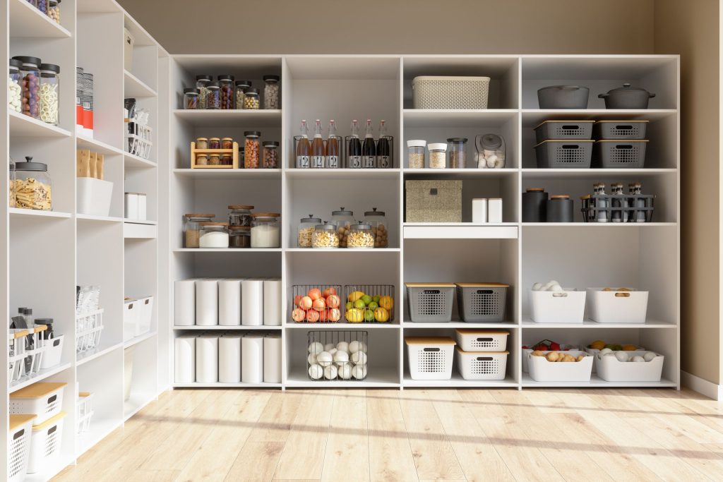 A well organized wall full of shelving and storage for a home attempting to maximize their small space.